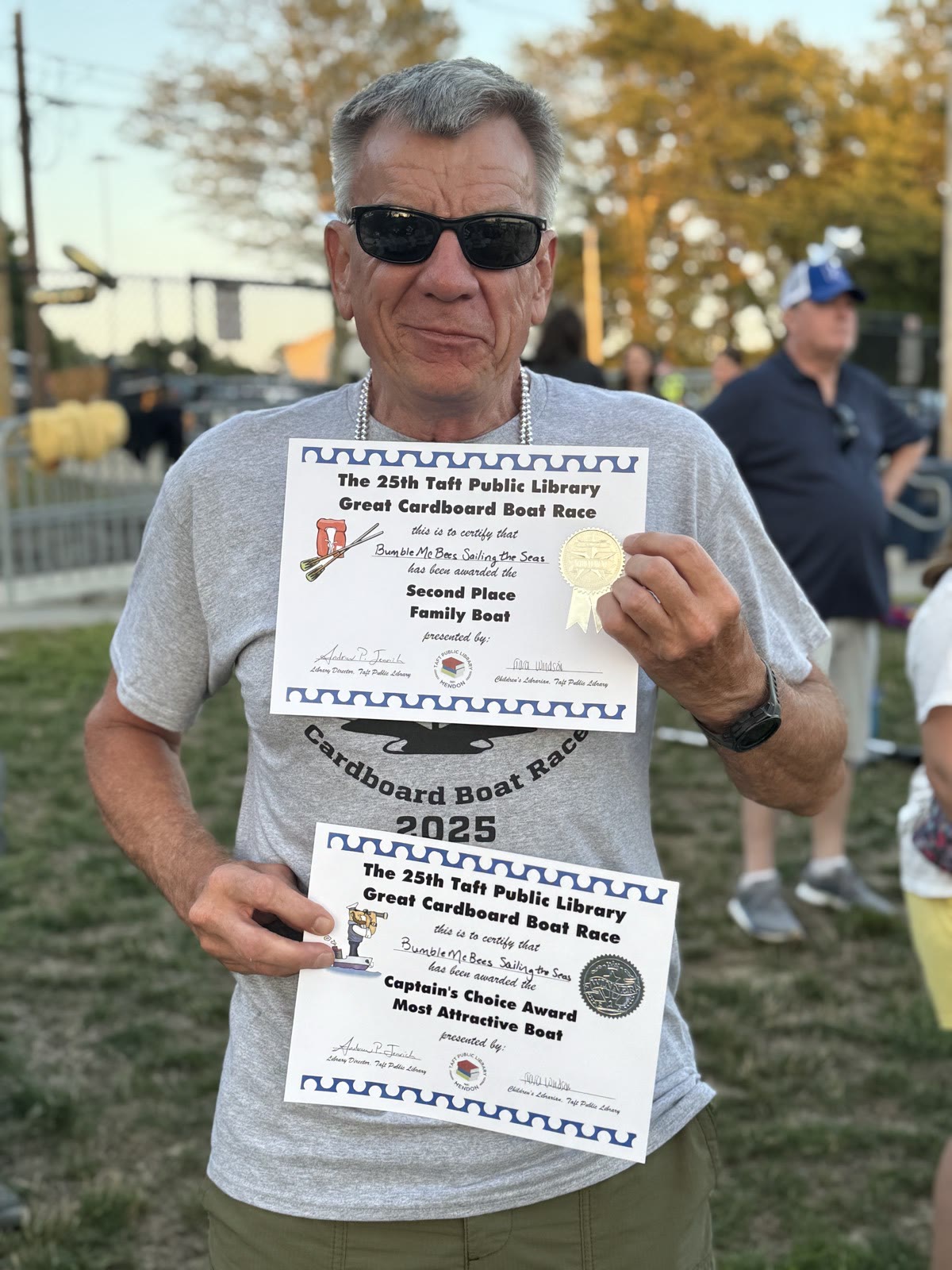 Capt. Dan Thistlewack holding the BumbleMcBees Second Place and Captain’s Choice awards
