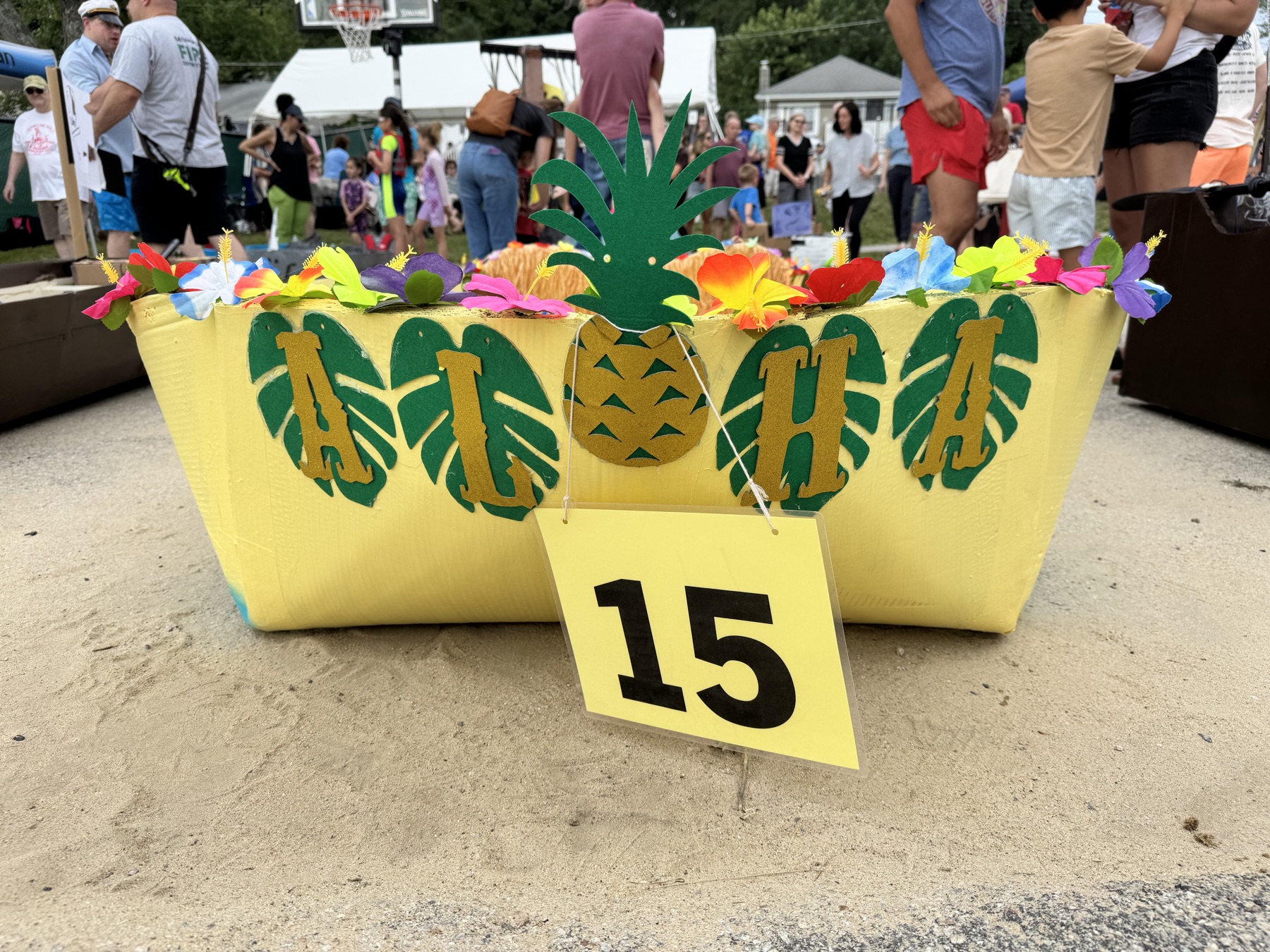 The tropical bow of The Unsinkable Luau with race number 15