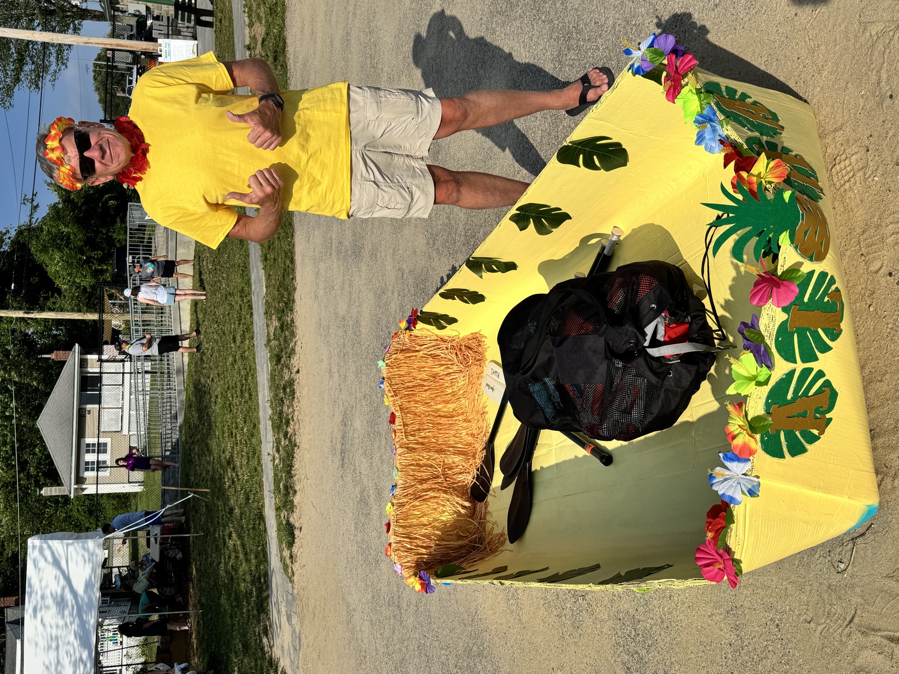 Captain Dan standing behind The Unsinkable Luau before the race