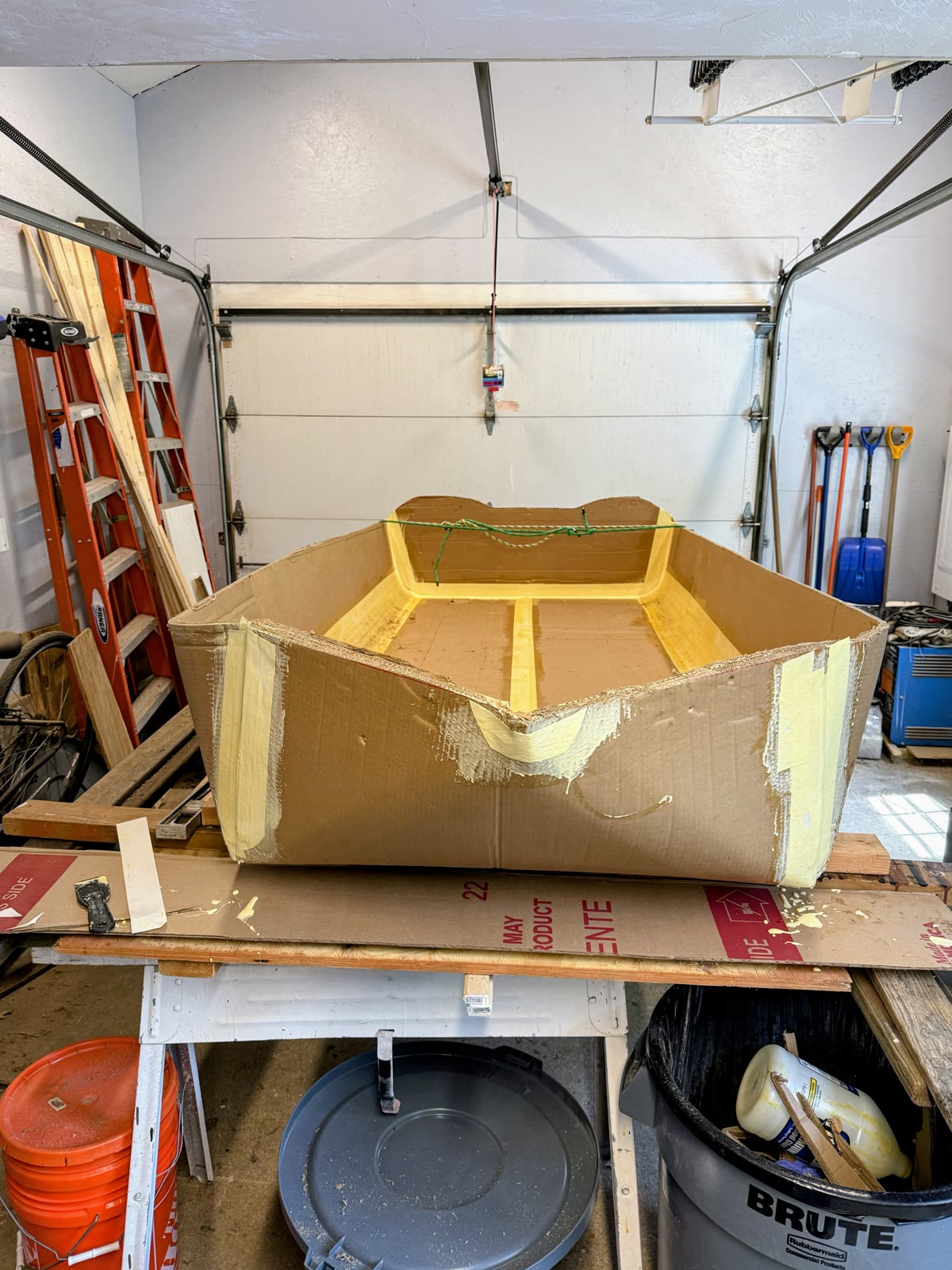 The Unsinkable Luau under construction with exposed corrugated hull panels and reinforced seams